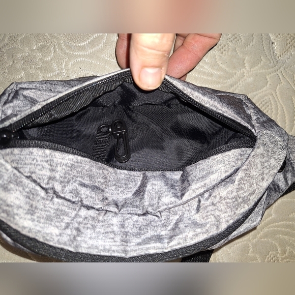A grey Adidas belt bag. It's in excellent condition. - Picture 3 of 5
